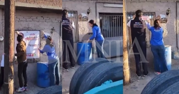 Video:  “Prianistas” quitan lona de Alejandro Pérez Cuéllar de vivienda para poner una de Marisela Terrazas